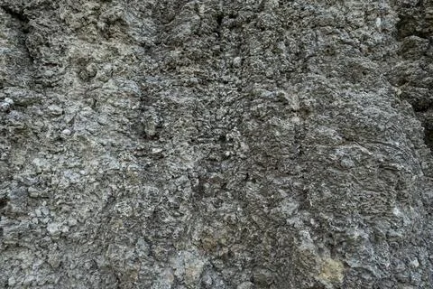 Stone mountain texture. A close up view of a steep stone quarry face showin.. Stock Photos