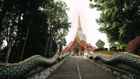 Stone naga serpent statues guarding temple at wat bang riang landmark in Phang Stock Footage 318526202
