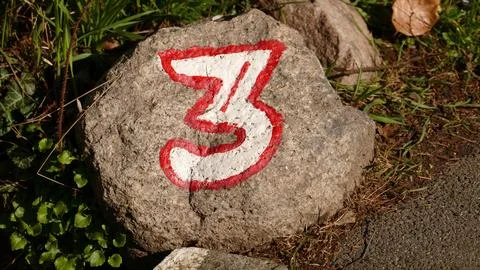 Stone with the number three Stock Photos