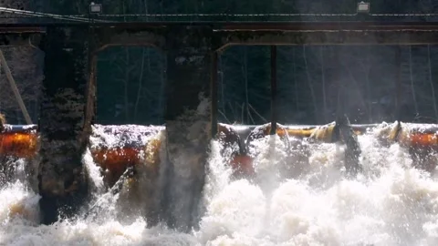 A stone old bridge over wild river in the sun rays in slow motion. Stock Footage 185752128