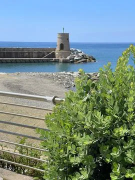 Stone old lighthouse in seafront town of Recco, Liguria. Nature, tourism and Stock Photos