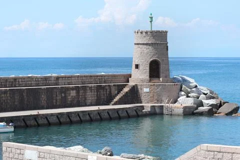 Stone old lighthouse in seafront town of Recco, Liguria. Nature, tourism and Stock Photos