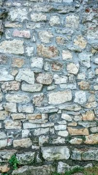 Stone old wall from huge blocks. Background of stones. The concept of Stock-Fotos