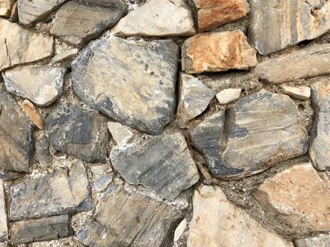 Stone old wall for texture background or abstract photo, close-up details Stock Photos