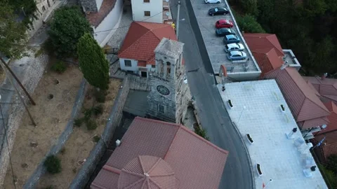 Stone Orthodox Bell Tower With Clock Near Village Square in Mountain Greece Video stock 324867645