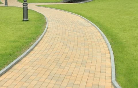 Stone path with grass Stock Photos