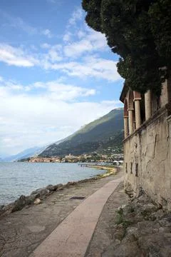 Stone path by the lakeshore Stock Photos