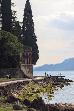 Stone path by the lakeshore Stock Photos