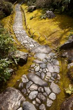 Stone path in mossy garden Stock Photos