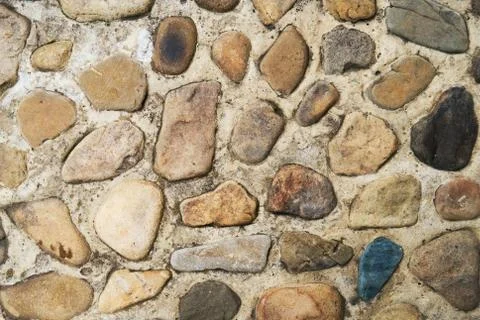 Stone path walkway made of pebbles and concrete. Natural texture for  background Stock Photos