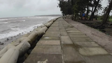 Stone Path Way At Beach Shore Line With Concrete Blocks Row And Trees Stock Footage 280563259