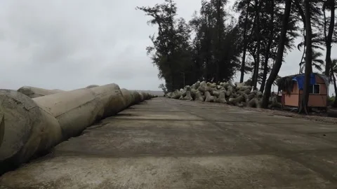 Stone Path Way At Beach Shore Line With Concrete Blocks Row And Trees Stock Footage 280564736