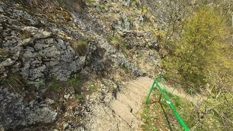 Stone path winds down forested slope. Mount Ozren, Serbia Видео 332729171