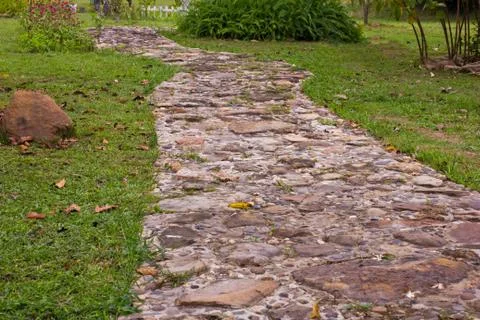 Stone pathway in the garden Stock Photos