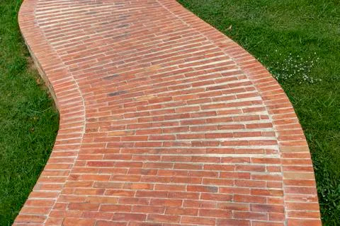 Stone pathway with grass Stock Photos