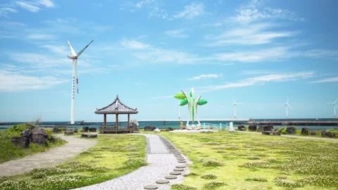Stone Pathway Leads to Gazebo and Sculpture at Singgyemul Park Jeju Island Stock Footage 341388684
