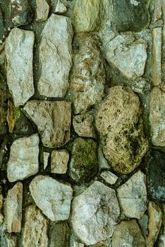 Stone pattern gray cobblestone uneven and old background vertical Stock Photos