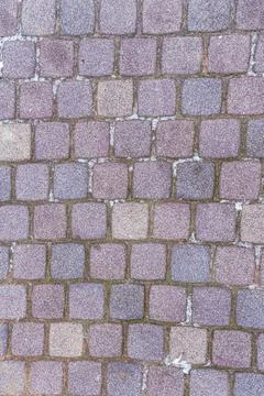 Stone pattern vertical background of gray square cobblestones Stock Photos