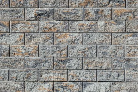 Stone patterned rectangular brick shape tiles aligned, exterior fence decor.. Stock Photos