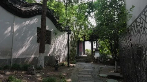 Stone Paved Courtyard Path Between White Walls In An Old Residence Stock Footage 346385465