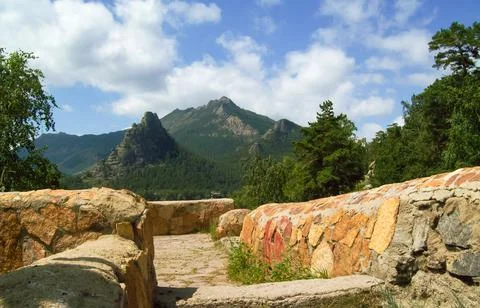 Stone paved path against the background of the Okzhetpes mountain Stock Photos