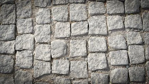 Stone pavement texture. Abstract background of cobblestone pavement Foto stock