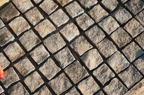 Stone pavement texture in perspective road surface Stock Photos