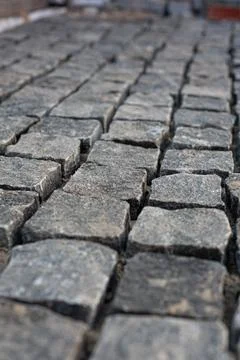 Stone pavement texture in perspective road surface Stock Photos