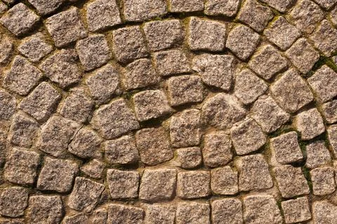 Stone pavement, top view. The texture of the cobblestone road. Foto stock