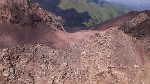 Stone peaks with cliffs. Grass grows in places. Stock Footage 158872635