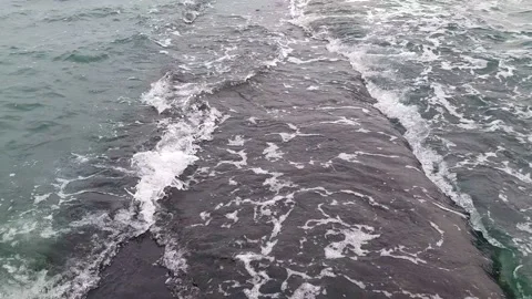 Stone pier on which the waves roll. Cloudy weather, rough sea. Stock Footage 150814213