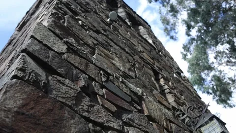 Stone pillar with an antique lantern tilting up Stock Footage 341907398