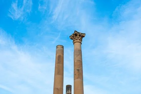 Stone pillars standing tall in malta, valletta with sunny clear blue skies Stock Photos