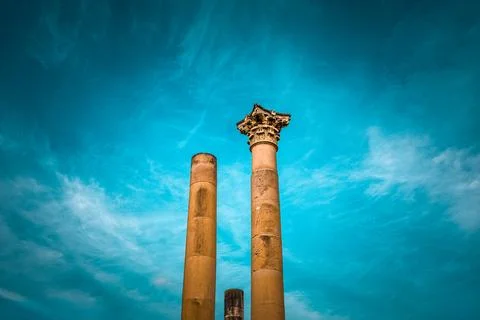 Stone pillars standing tall in malta, valletta with sunny clear blue skies Stock Photos