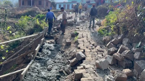 Stone Pitching on Rural Foot Path Видео 327385090