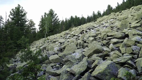 Stone placers on the slope of the mountain. Mountain landscape on a summer day. Stock Footage 93345763