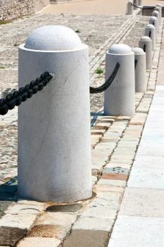 Stone post fence in perspective Stock Photos