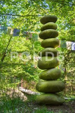 Stone pyramid of pebbles - concept for life, power, energy, zen or courage. Stock Photos