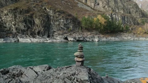 Stone pyramid with river mountains background. Stock Footage 304800957