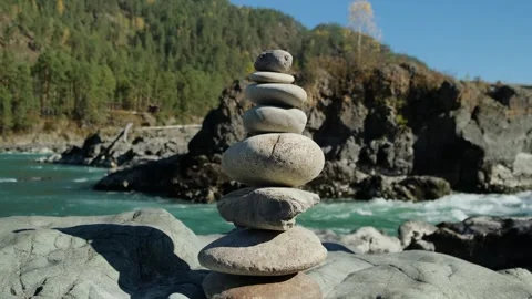 Stone pyramid with river mountains background. Stock Footage 304800975