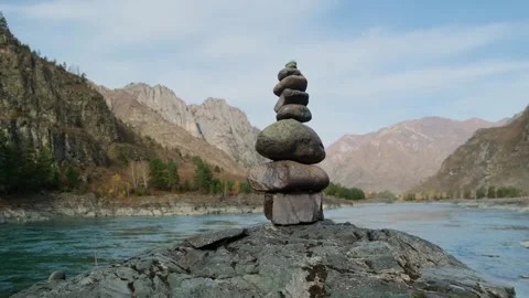 Stone pyramid with river mountains background. Stock Footage 304801044