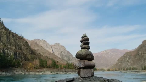 Stone pyramid with river mountains background. Stock Footage 305430464