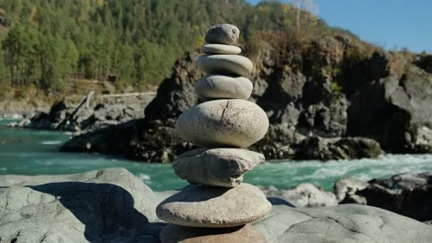 Stone pyramid with river mountains background. Stock Footage 307899096