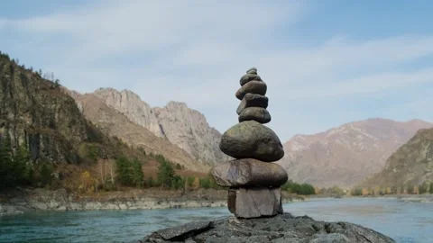 Stone pyramid with river mountains background. Stock Footage 309623908