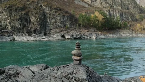 Stone pyramid with river mountains background. Stock Footage 311305074
