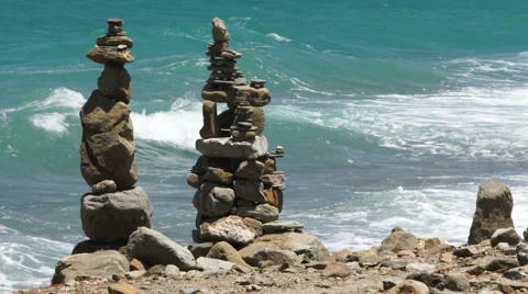 Stone pyramids and the waves Stock Footage 67676085