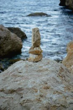 Stone pyramids on the beach Stock Photos