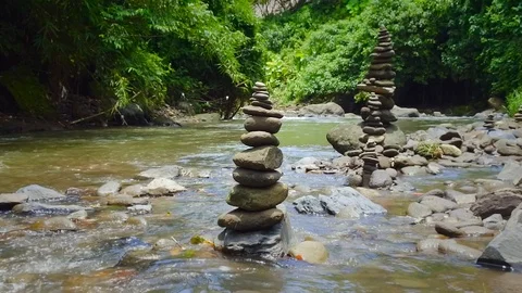 Stone pyramids in river Stock Footage 108506980