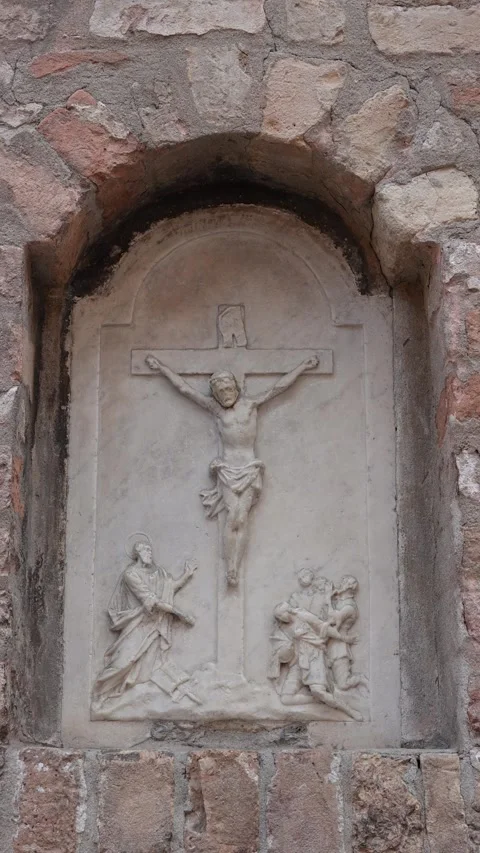 Stone Relief of Jesus on the Cross Set into Old Wall, Venice, Italy Stock Footage 346264011