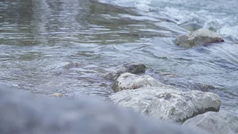 Stone, river - Slomo Stock Footage 77551716